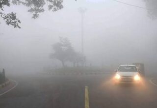 Heavy fog on a rural road in सीमांचल लाइव, creating low visibility and atmospheric weather conditions.